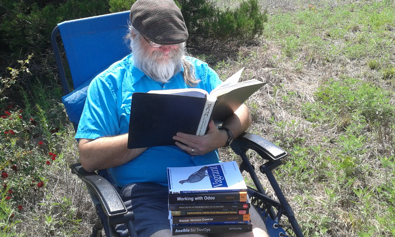 Terry Hancock holding books and reading