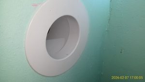 3-inch port in office closet wall for cables.