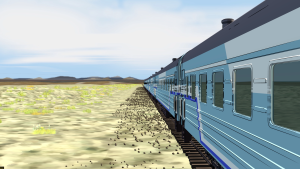 Train viewed from the side, looking down the tracks.