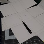 Posterboard cut and scored for folding.